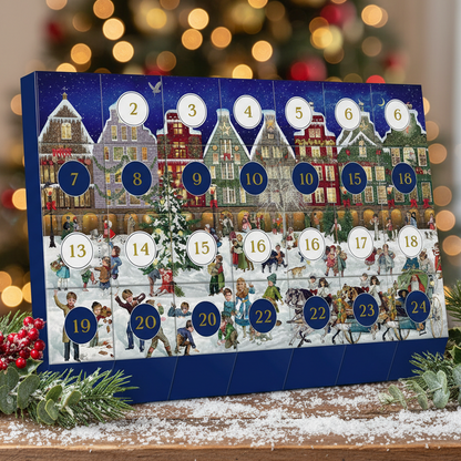 Advent calendar with Christmas-themed design on a table with festive decorations.