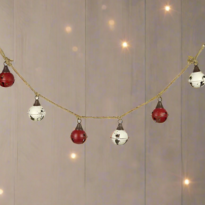 A Vintage Style Red and White Christmas Bell Garland with metal bells and jute rope.