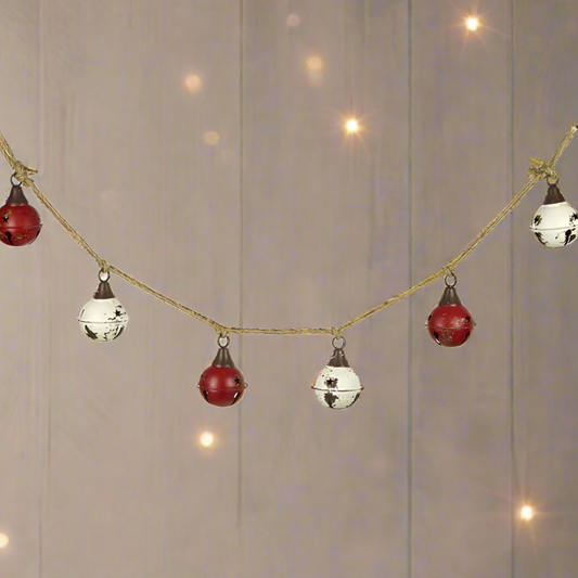 A Vintage Style Red and White Christmas Bell Garland with metal bells and jute rope.