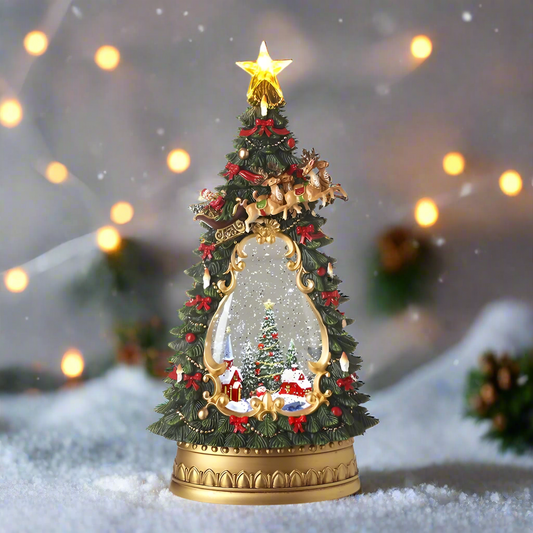 A decorative Christmas tree-shaped water spinner lantern with LED lights, ornaments, and a star on top.
