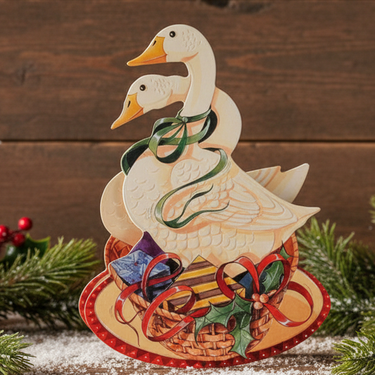 A greeting card featuring two embossed and diecut geese with Christmas gifts and decorations on a decorative red and gold background.