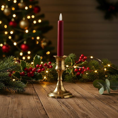 A red wax LED Christmas dinner candle with a white base, designed to resemble a traditional candle.