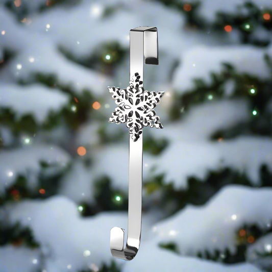 A silver-colored metal wreath hanger with a snowflake design at the top.