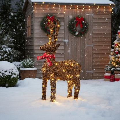 A 70cm tall wicker reindeer decoration with a red bow and warm white LED lights, intended for Christmas display.