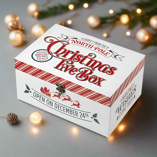A wooden Christmas Eve box with a 'North Pole' and 'Open on December 24th' inscription, featuring a keyhole on the front.
