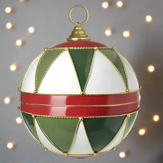 A large hanging Christmas ornament with a geometric pattern in red, green, white, and gold colors.