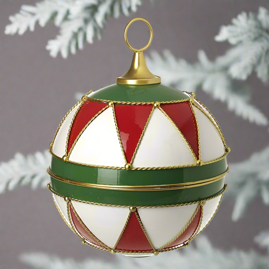 A large decorative holiday ornament featuring a red, green, white, and gold patterned design with a gold top ring for hanging.
