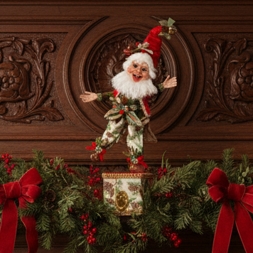 Decorative Christmas mantel with a Santa figure, greenery, and red bows against a wooden panel background.
