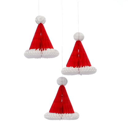 Three red and white paper honeycomb Santa hats with string for hanging