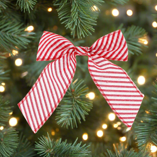 A red and white striped fabric bow