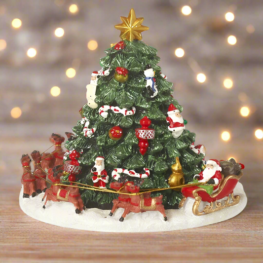 A musical Christmas tree ornament featuring Santa Claus and a sleigh at its base, with a revolving mechanism.