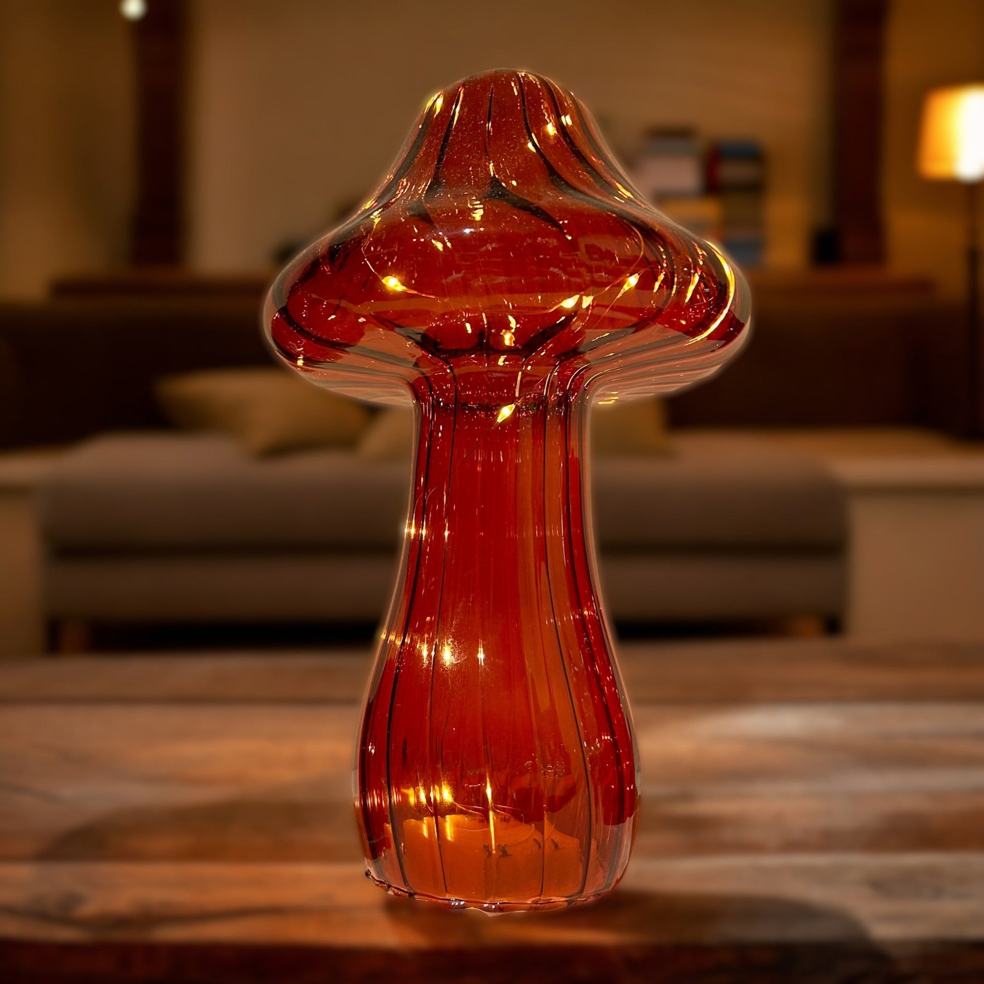 Decorative glass vase on a wooden table with a blurred indoor background