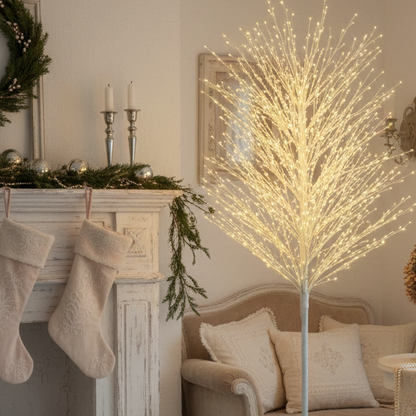 A white microdot Christmas twig tree with warm white LED lights, displayed against a dark background