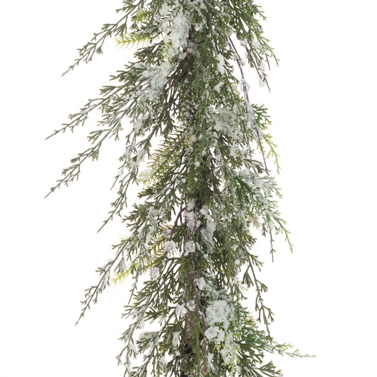 Faux Christmas garland with snow effects on a white background