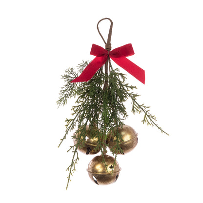 Decorative Christmas ornament with gold bells and greenery on a white background