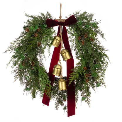 Decorative wreath with gold bells and red ribbon on a white background