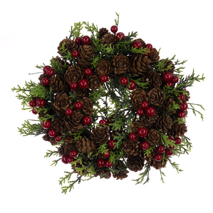 Christmas wreath with pine cones and red berries on a white background