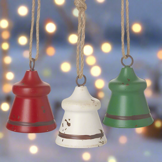 Three rustic hanging Christmas bells in red, green, and white colors with jute ropes for hanging.