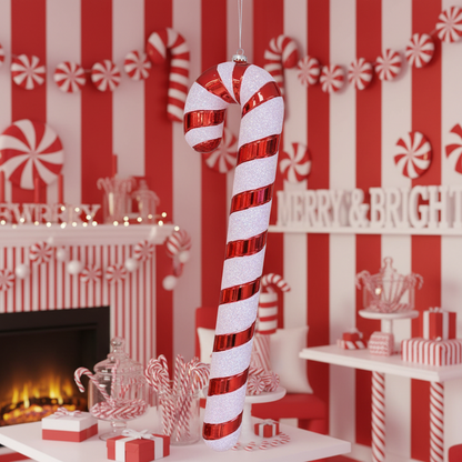 Decorative candy cane ornament hanging on a wooden wall with Christmas decorations.