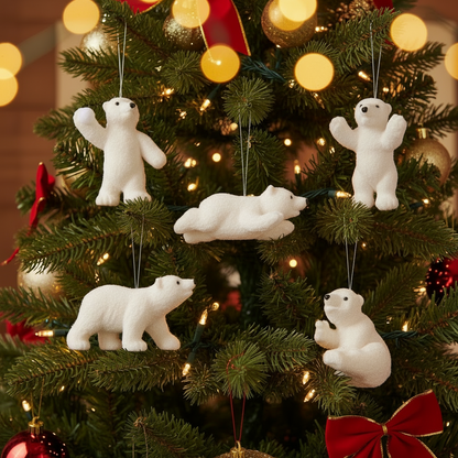 Set of five hanging polar bear ornaments on a white background
