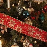 Decorative red ribbon with white floral pattern on a white background