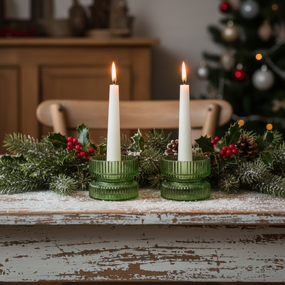 A green glass candle holder with a diameter of 9cm.