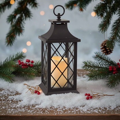 A vintage-style lantern with a flickering candle, primarily black in color, placed on snow-covered ground with Christmas decorations around.