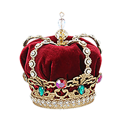A red velvet jewelled Christmas crown tree topper with a golden crown and red velvet base, adorned with sparkling jewels.