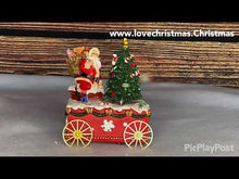 Load and play video in Gallery viewer, Musical Santa With Tree on Cart Christmas Music Box
