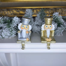 Load image into Gallery viewer, Gold and Silver Set of 2 Nutcracker Stocking Hangers
